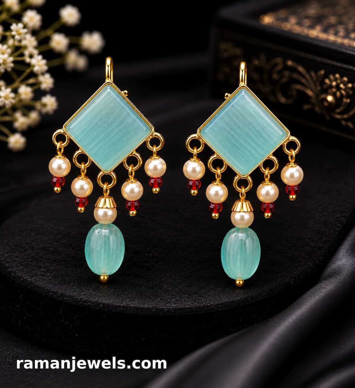 Elegant Gold-Plated Statement Earrings, Beautifully Crafted With A Soft Aqua-Blue Geometric Stone, Delicate Pearl Charms, Sparkling Red Crystal Accents alternate view